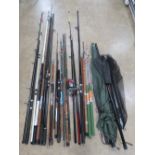 A quantity of assorted contemporary coarse fishing gear including rods, landing nets, umbrella,