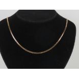 A 9ct gold flattened box link chain necklace complete with safety chain, hallmarked 375,