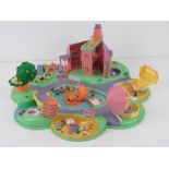 Polly Pocket; c1990s being a cluster of houses inc lake with treasure island, beach, stables,