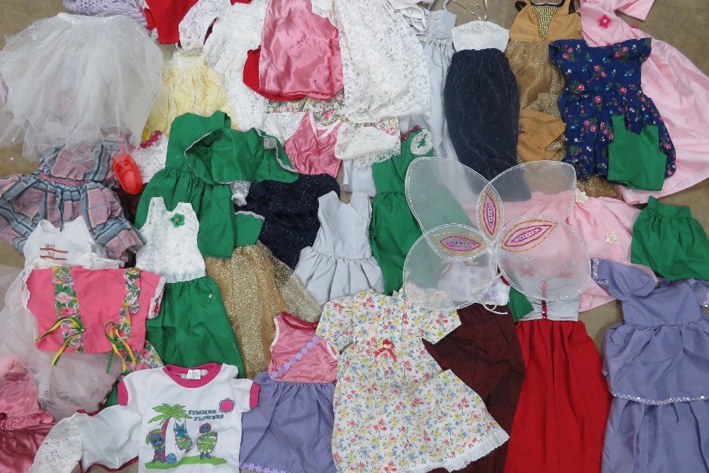 A large quantity of handmade dolls clothes for 'lifesize' doll.