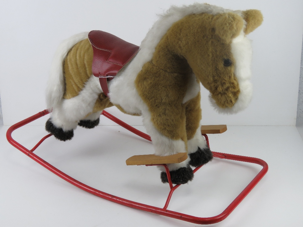 A rocking horse by Nylena having leatherette saddle and having been known as Sherbert for the past