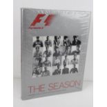 F1 The Season, 2003 edition with foreword by Bernie, portrait photography by Mikael Jansson.