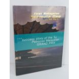 The Success Story of the 1st Petronas Malaysian Grand Prix. Hardback book. In plastic wrap.