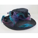 Ladies hat by Helene De Reboul in purples and blues, in box.
