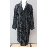 A ladies 3/4 length faux fur coat by Windsmoor, UK size 14.