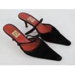 Pantalon Chameleon; a pair of ladies kitten heel slingback black velvet shoes having leather soles,