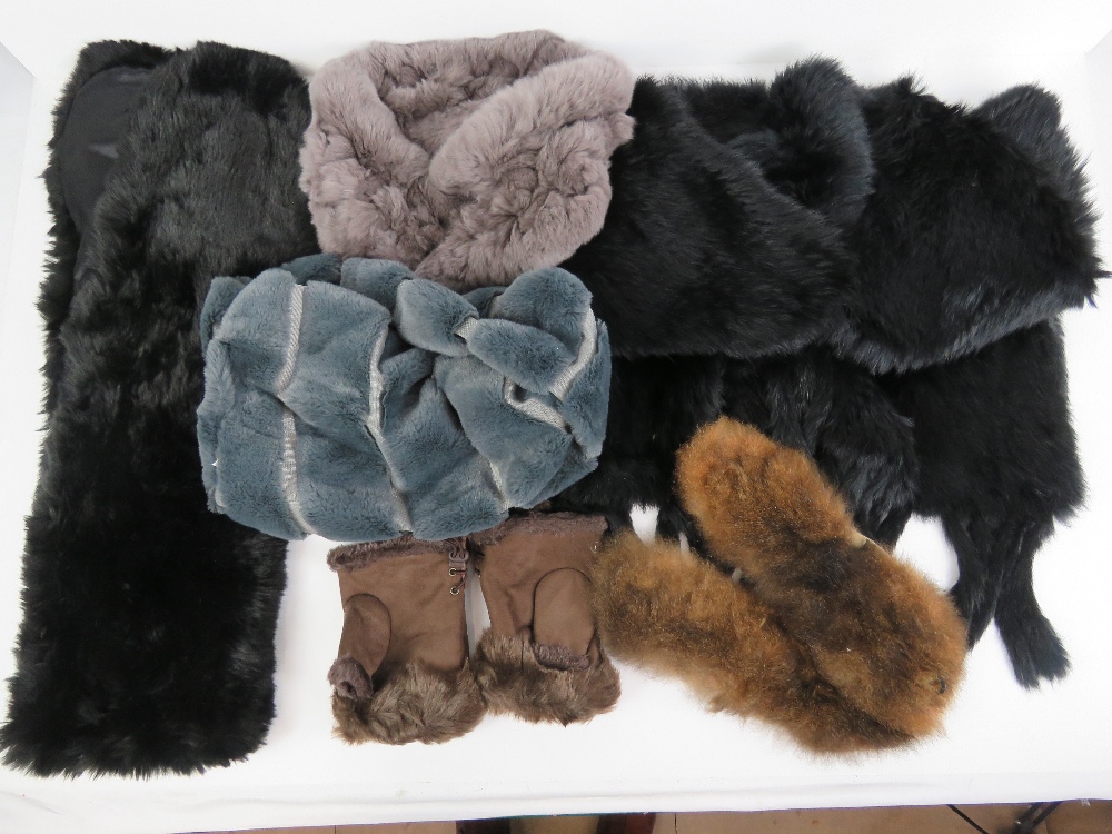 A quantity of faux fur shawls and scarves,