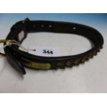 A VINTAGE LEATHER AND BRASS STUDDED DOG COLLAR.