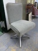 A MID CENTURY EVERTAUGHT SEATING SWIVEL CHAIR.