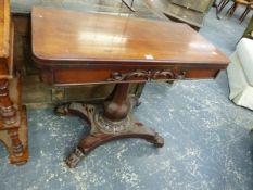 A MAHOGANY GAMES TABLE, THE SWIVEL TOP OPENING TO REVEAL A CIRCULAR BAIZE INSET, THE APRON WITH