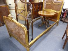 A FRENCH CARVED GILTWOOD SINGLE BED WITH BERGERE PANEL ENDS. 97 x 203cms.