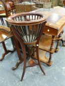 A MAHOGANY PLANT STAND, THE CHEQUER INLAID CIRCULAR RIM ABOVE THREE COPPER LION MASKS AT THE TOP