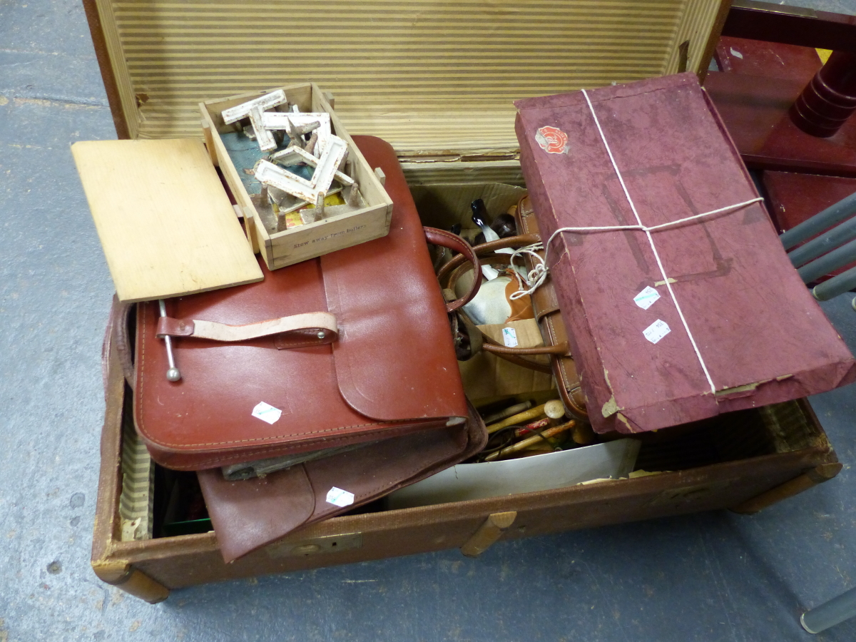 A VINTAGE TRUNK CONTAINING VARIOUS GAMES, TOYS, HANDBAGS, ETC TO INCLUDE A MAZDA SET OF DISNEY