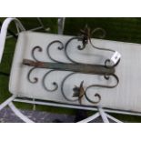 A SET OF FOUR WROUGHT IRON WALL MOUNTED TWO BRANCH CANDLE SCONCES. (4)