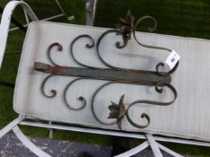 A SET OF FOUR WROUGHT IRON WALL MOUNTED TWO BRANCH CANDLE SCONCES. (4)