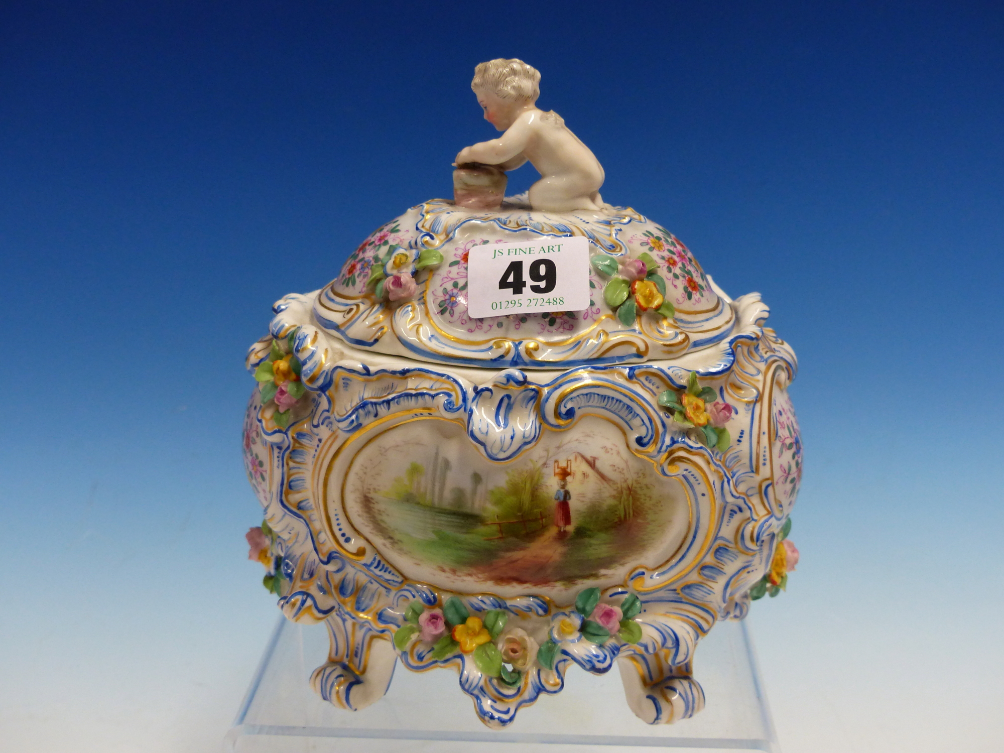 A PASSAU COVERED PORCELAIN BOWL PAINTED WITH BLUE ROCOCO FRAMED RESERVES OF A WATER MILL AND OF A