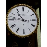 A SEILER FERENZ, PESTEN THREE TRAIN WALL CLOCK, THE GLAZED CASE MOUNTED IN THREE COLOURS OF WOOD,