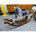 A SMALL ROCKING HORSE ON LONG CURVED ROCKERS.