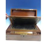 A VICTORIAN MAHOGANY WRITING BOX WITH RECESSED BRASS MOUNTS.