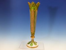 A BOHEMIAN WHITE OVERLAY GREEN GLASS VASE, THE GILT PANELS ALTERNATING WITH DIAMOND DIAPER CUT ONES.