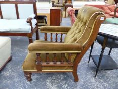 A PAIR OF VICTORIAN OAK FIRESIDE ARMCHAIRS WITH BUTTON BACKS AND TURNED ARM SUPPORTS ON STOUT TURNED