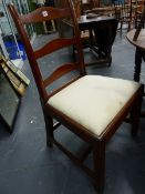 THREE GEORGIAN MAHOGANY LADDER BACK CHAIRS, EACH WITH THREE RUNGS BETWEEN CYLINDRICAL UPRIGHTS,