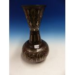 A QAJAR SILVER WIRE KOFTGARI STEEL VASE, THE WAISTED CYLINDRICAL NECK WITH LEAVES IN LAPPETS, THE