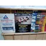 THREE MOTOR RACING POSTERS TO INCLUDE ONE SIGNED BY JAMES HUNT. TOGETHER WITH A FRAMED BOXING