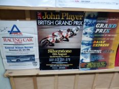 THREE MOTOR RACING POSTERS TO INCLUDE ONE SIGNED BY JAMES HUNT. TOGETHER WITH A FRAMED BOXING