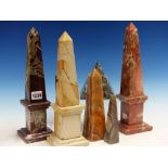 THREE HARDSTONE OBELISKS. H.33cms TOGETHER WITH A STONE CUBE AND PYRAMID, ETC.