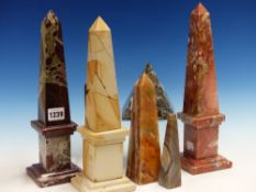 THREE HARDSTONE OBELISKS. H.33cms TOGETHER WITH A STONE CUBE AND PYRAMID, ETC.