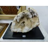 A LARGE DIVIDED GEODE, EACH SECTION MOUNTED ON EBONISED BASE WITH LED LIGHTING.