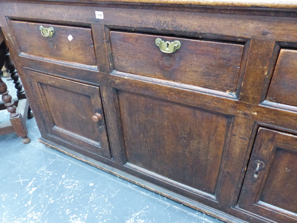 A GEORGIAN PINE DRESSER THE THREE DRAWERS WITH BRASS HANDLES ABOVE TWO CUPBOARDS FLANKING A - Image 3 of 6