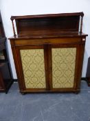 A REGENCY ROSEWOOD SIDE CABINET, THE RECTANGULAR TOP WITH REAR RECESSED SHELF, THE DAMASK INSET