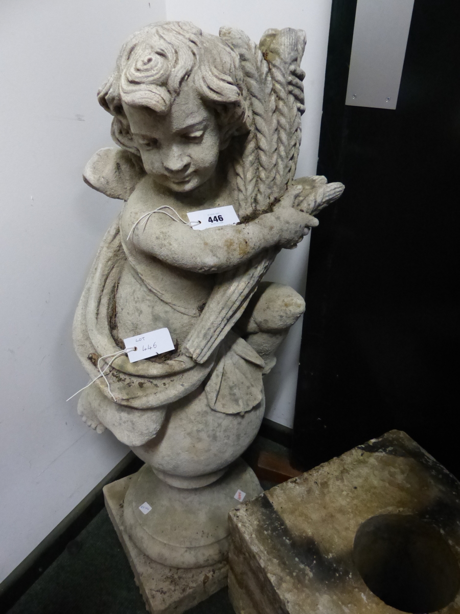 A VINTAGE WEATHERED GARDEN FIGURE OF PUTTI WITH WHEATSHEAF ATOP A SPHERE ON A PLINTH BASE. H.