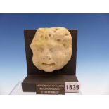 A ROMAN HELLENISTIC STONE GROTESQUE HEAD MASK c.100BC-100AD. H.10cms.