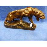 A GOLD DUSTED BROWN PATINATED PLASTER FIGURE OF T CARTIER'S LIONNE EN FURIE BY L MARTINI. W 72cms.