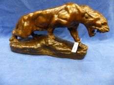 A GOLD DUSTED BROWN PATINATED PLASTER FIGURE OF T CARTIER'S LIONNE EN FURIE BY L MARTINI. W 72cms.