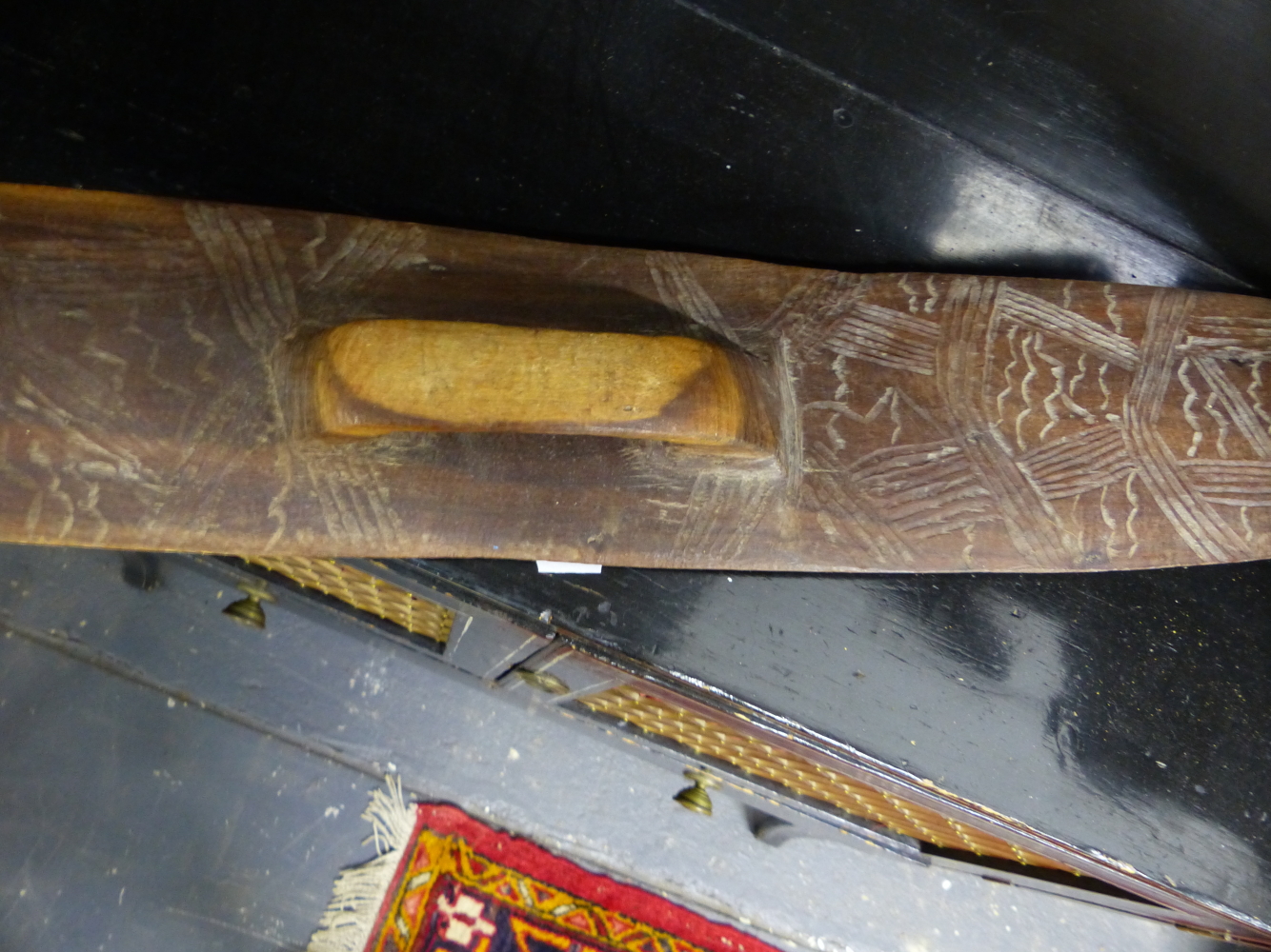 AN ABORIGINAL WOODEN SHIELD AND A BOOMERANG RELIEF CARVED WITH A KANGEROO AND A MOA. - Image 3 of 3