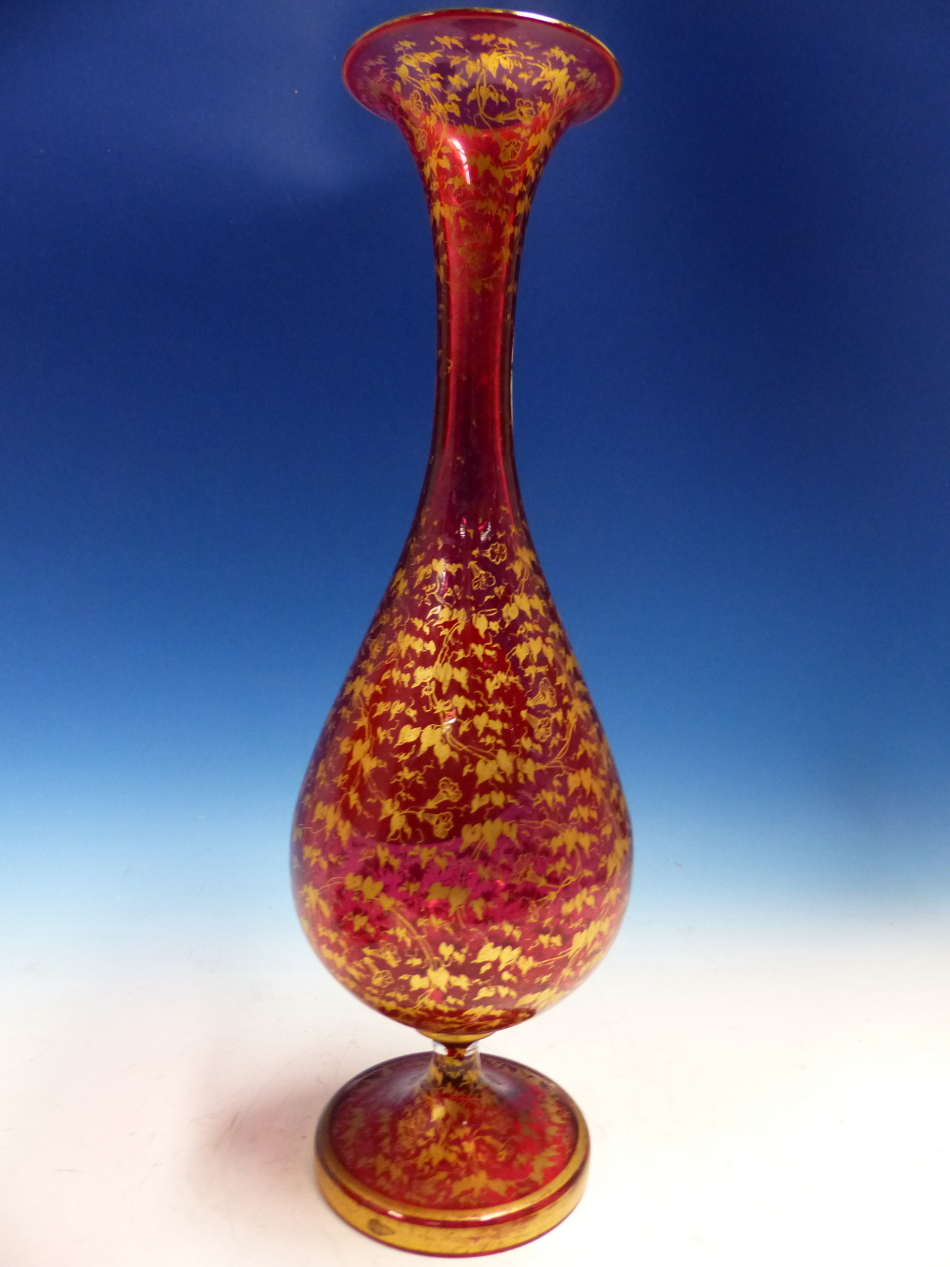 A BOHEMIAN GILT CRANBERRY GLASS BALUSTER VASE PAINTED WITH A RAISED OVAL OF A LADY. H 36cms. - Image 2 of 2