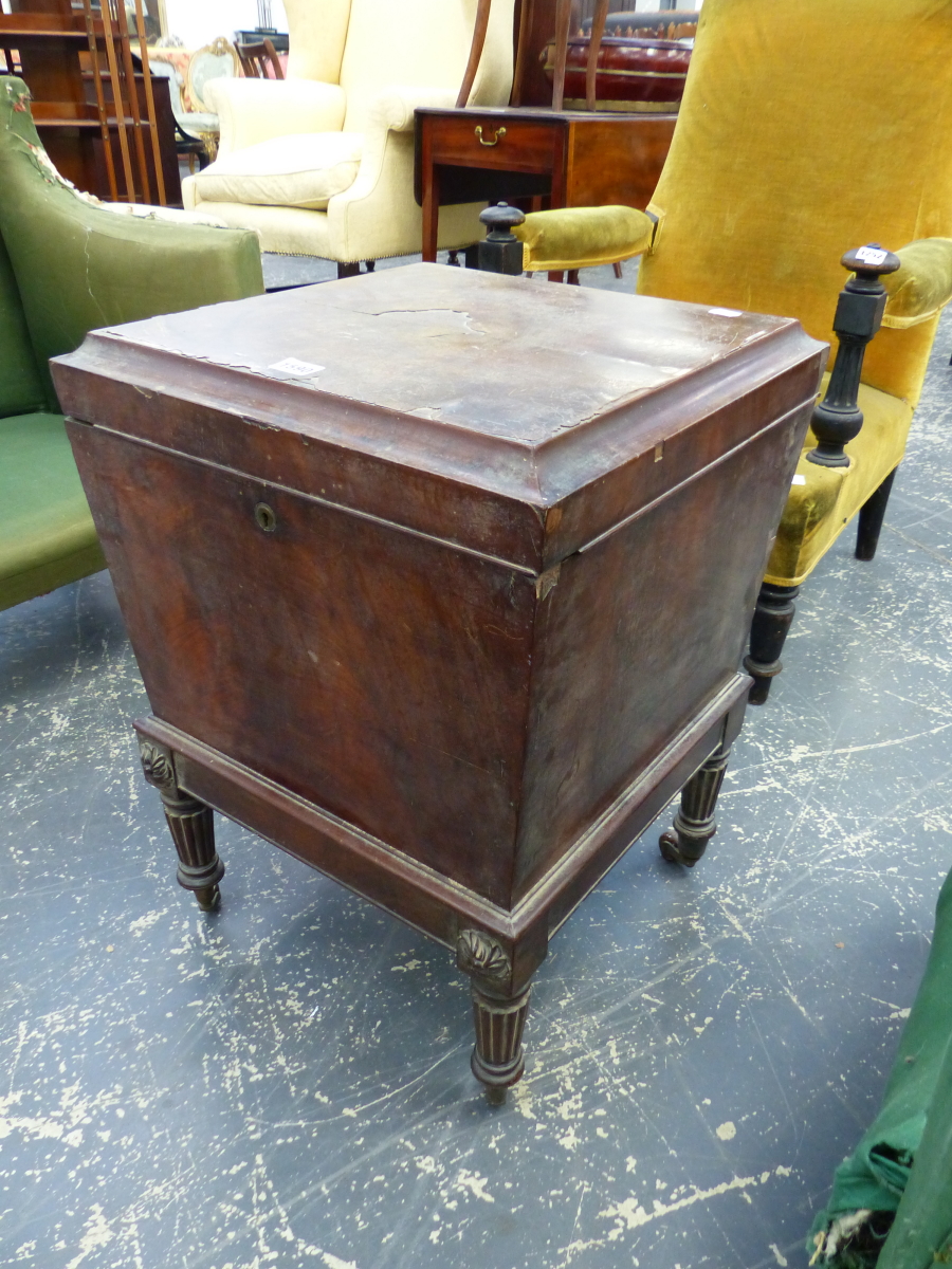 A GEORGIAN MAHOGANY SMALL CELLARETTE ON TURNED REEDED LEGS.