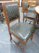 A SET OF EIGHT OAK NEOGOTHIC CHAIRS BY HOLLAND AND SONS WITH LEATHER BACKS AND SEATS, THE TURNED