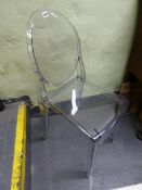 A PAIR OF CLEAR PLASTIC CHAIRS BY KARTELL WITH OVAL BACKS AND MOULDED SQUARE FRONT LEGS AND A