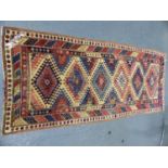 AN ANTIQUE KAZAK RUG. 250 x 107cms.