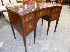 AN ANTIQUE MAHOGANY INLAID GEORGIAN AND LATER SIDEBOARD OF CONCAVE FORM WITH FOUR DRAWERS ON TAPERED