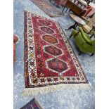 A PERSIAN TRIBAL RUG. 250 x 135cms.