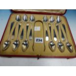 A CASED SET OF TWELVE HALLMARKED SILVER TEA SPOONS WITH SUGAR TONGS.