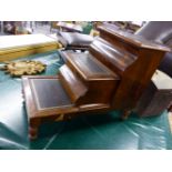 A VICTORIAN MAHOGANY BED STEP ON TURNED SUPPORTS.