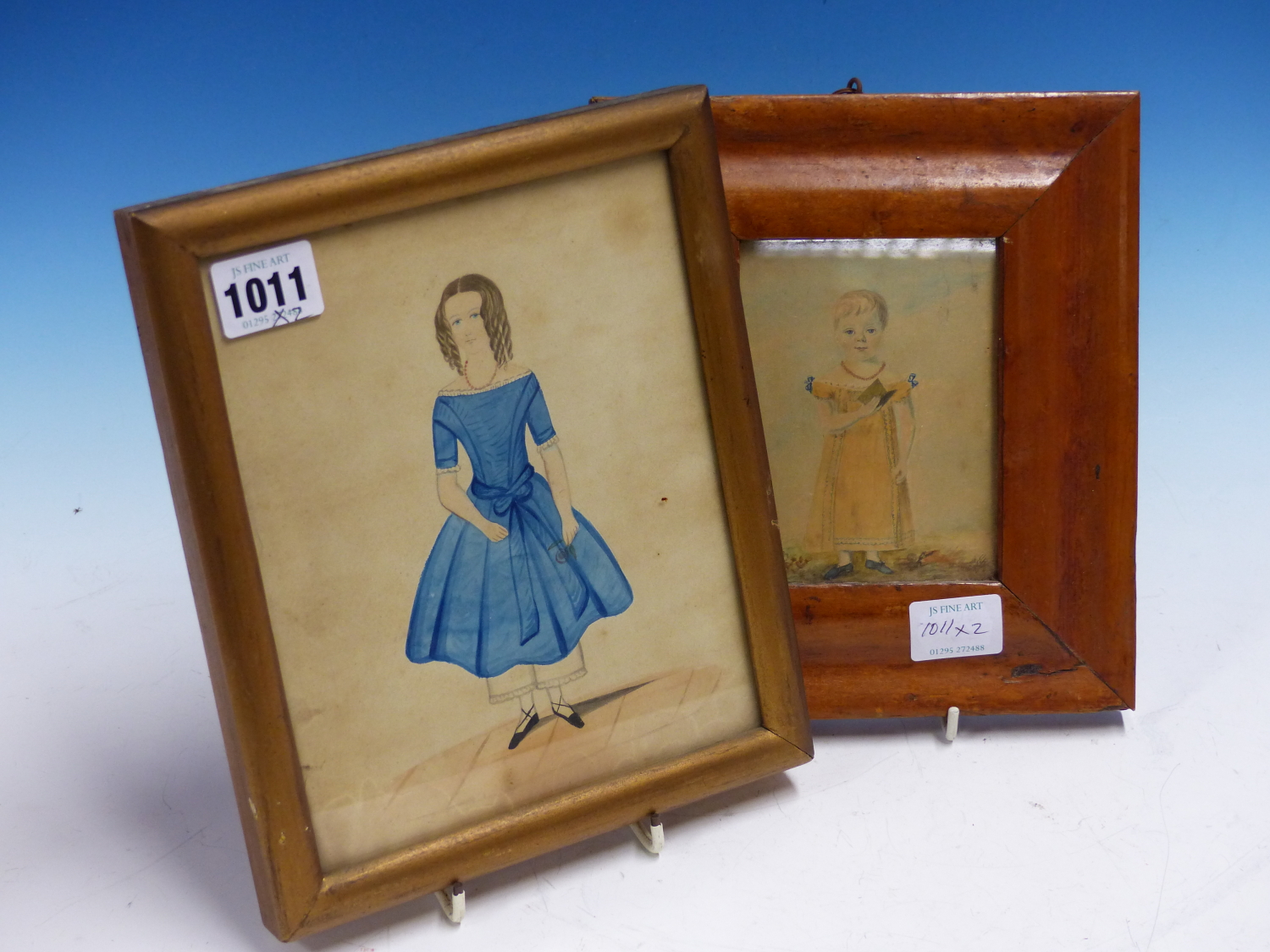 19th.C.ENGLISH NAIVE SCHOOL. TWO PORTRAITS OF GIRLS, WATERCOLOURS. LARGEST 19 x 15.5cms. (2)