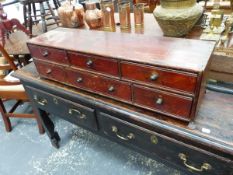 A 19th.C.TABLE TOP COLLECTOR'S CHEST OF SIX DRAWERS ON CAST BRASS FEET. 86 x 25 x H.22cms.